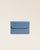 Notre porte-papiers Aurore en cuir façon vigogne bleu cobalt vu de face fermé en studio.