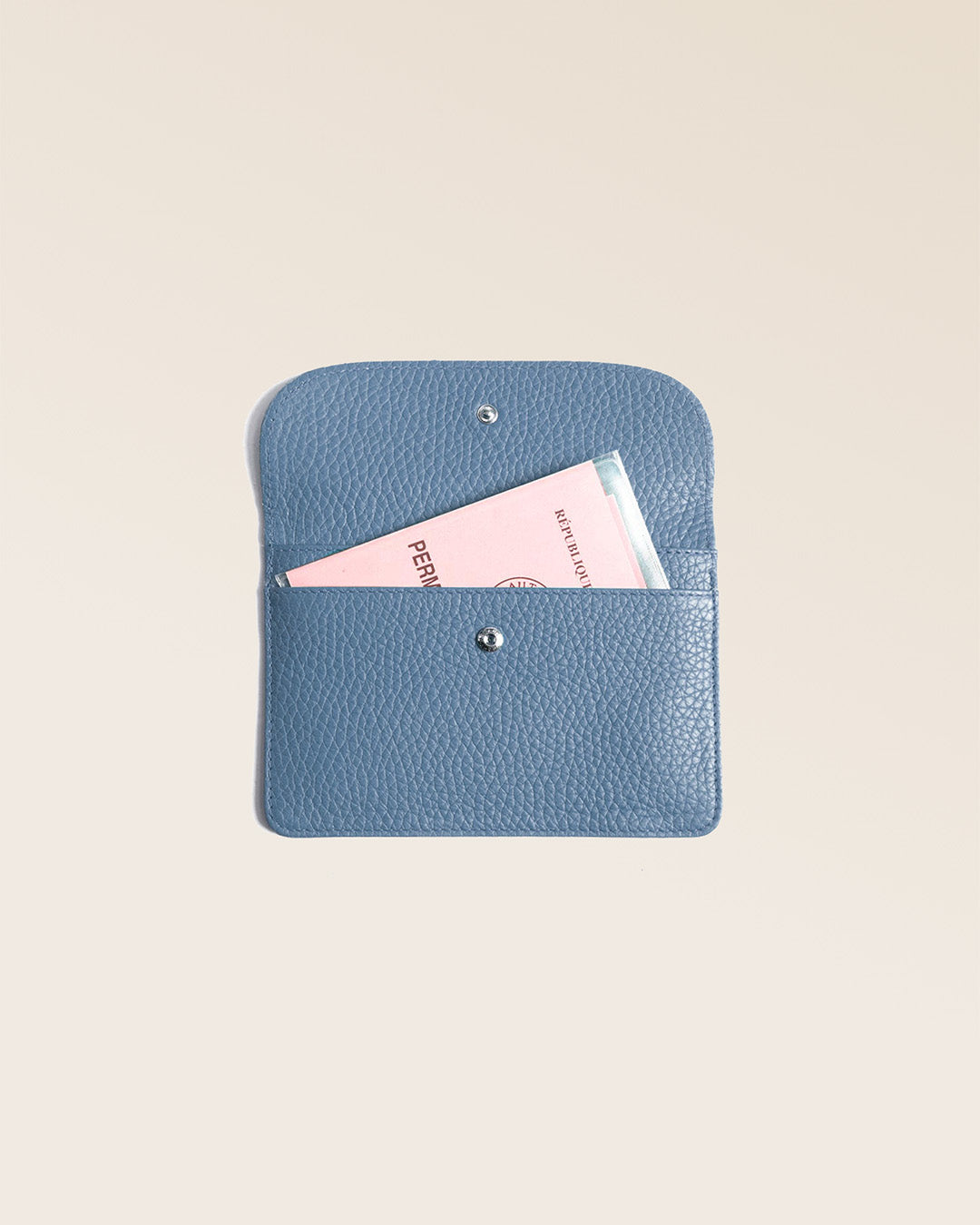 Our Aurore paperweight in cobalt-blue vicuña-style leather, seen from the front in the studio.