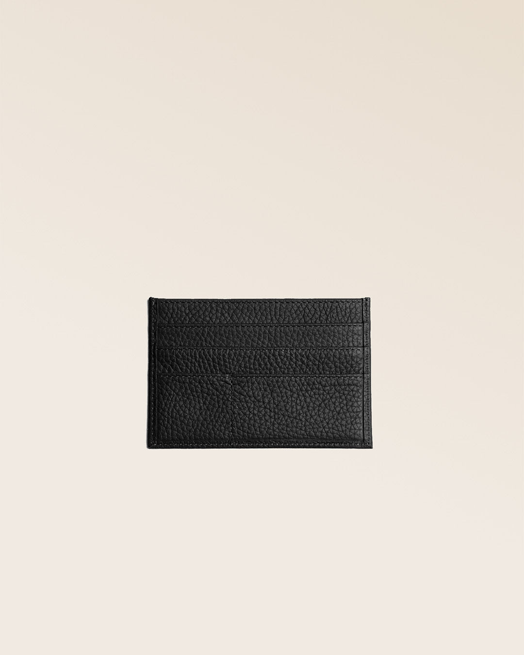 Notre porte-papiers en cuir façon vigogne noir vu de dos en studio.