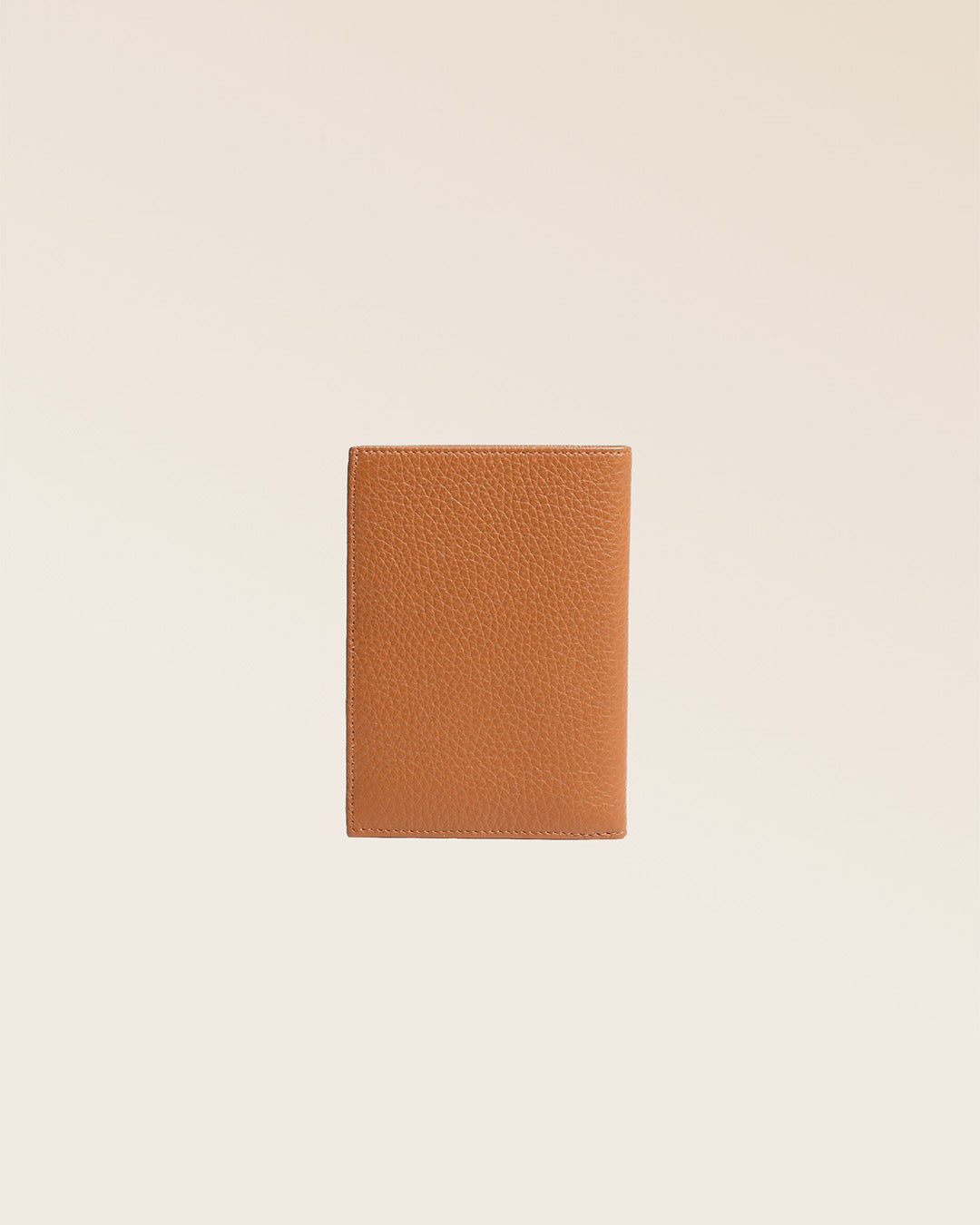Our Papiers wallet in fawn-colored vicuña leather, seen from the back in the studio.