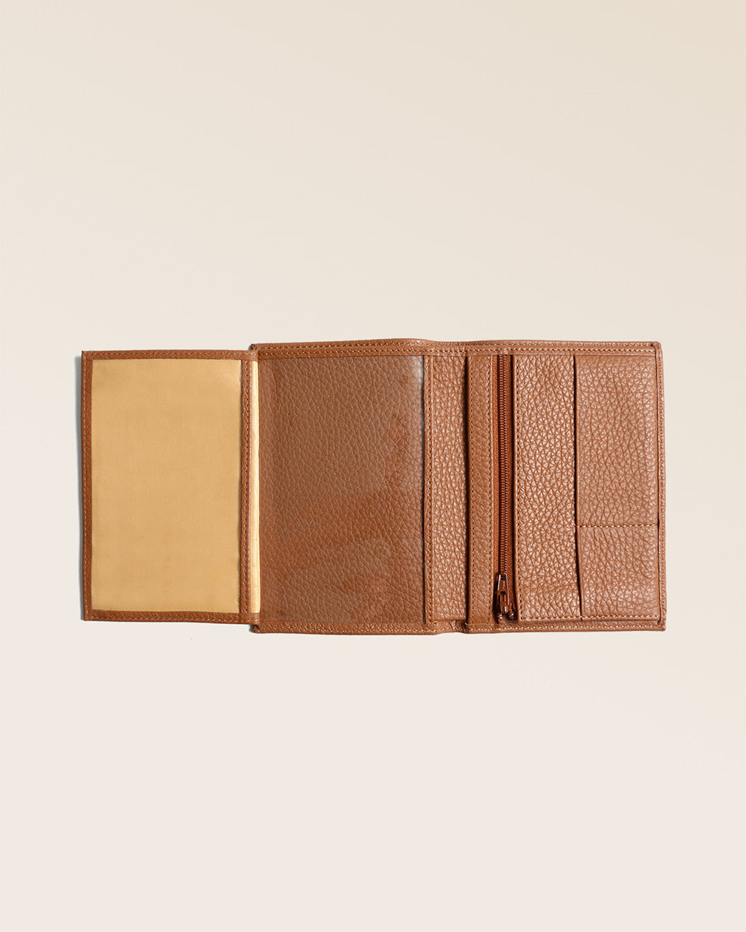 Our Papiers wallet in fawn-colored vicuña leather seen open in the studio.