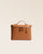 Our large tan vicuña-style leather vanity seen from the front in the studio.