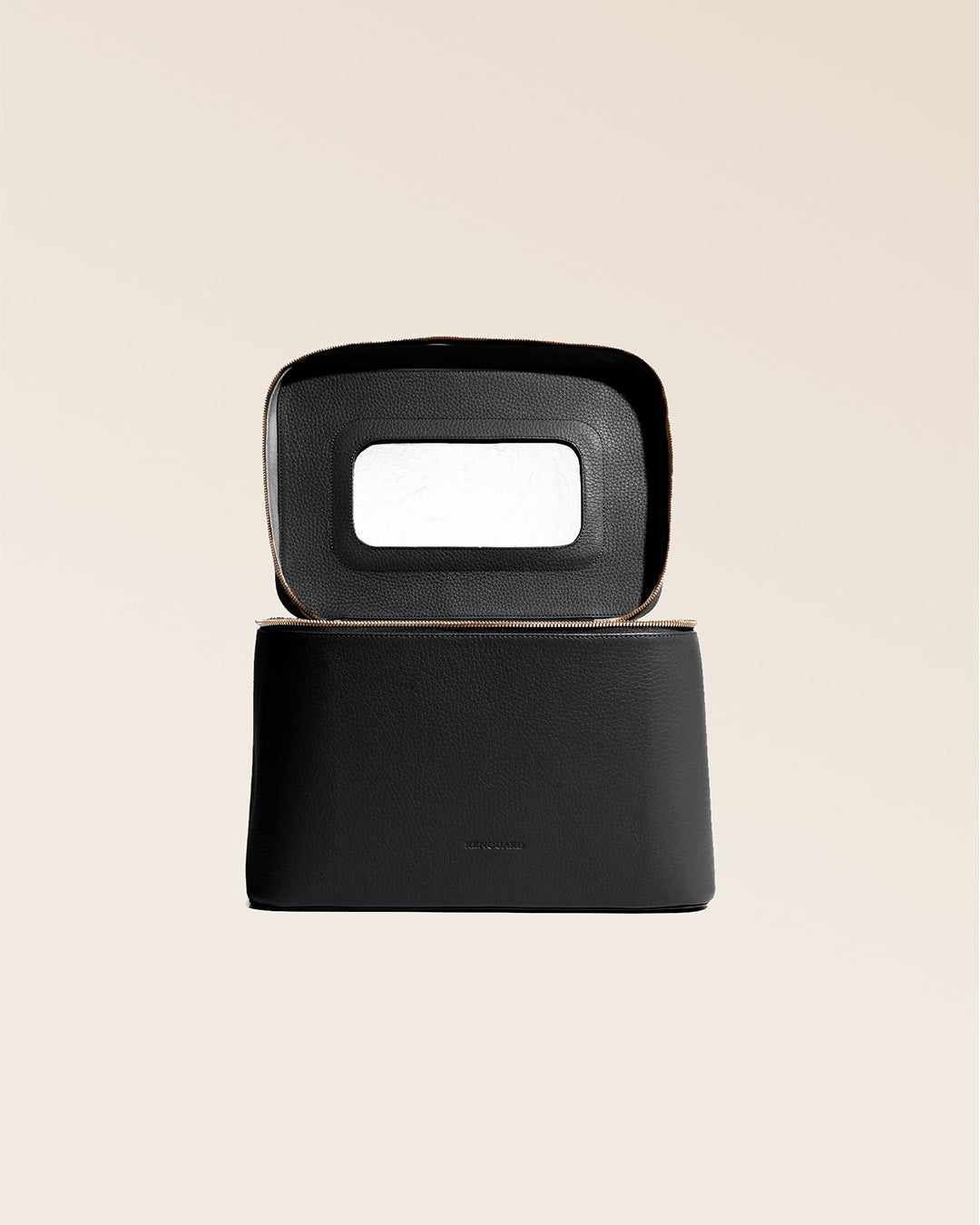 Our large black vicuña-style leather vanity, seen from the front in the studio.