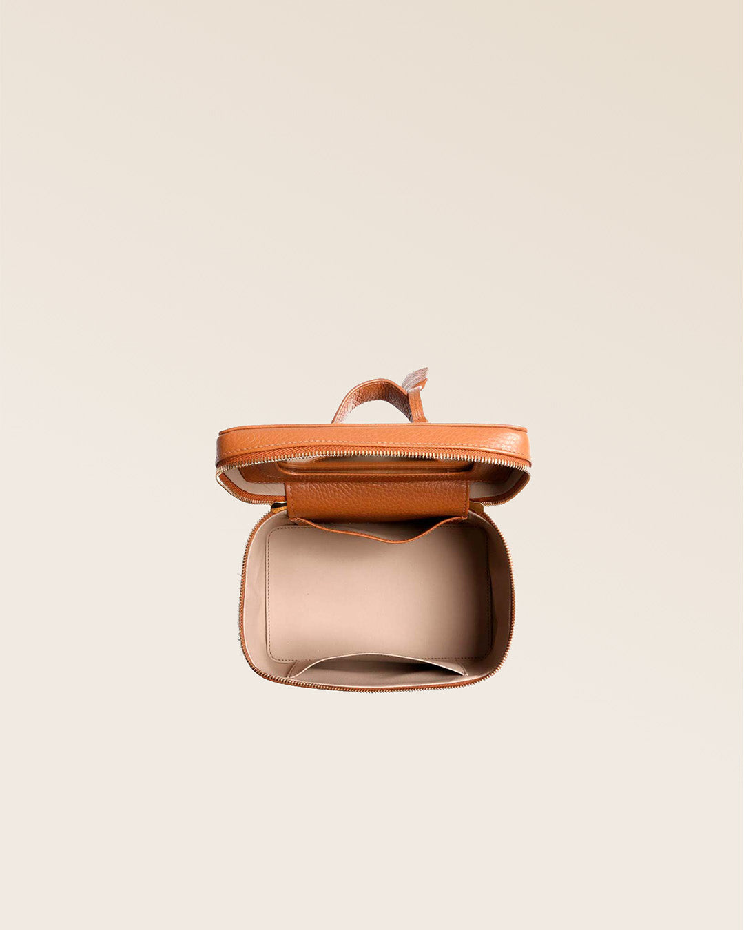 Our little vanity in fawn-colored vicuña leather, seen from the top when open in the studio.