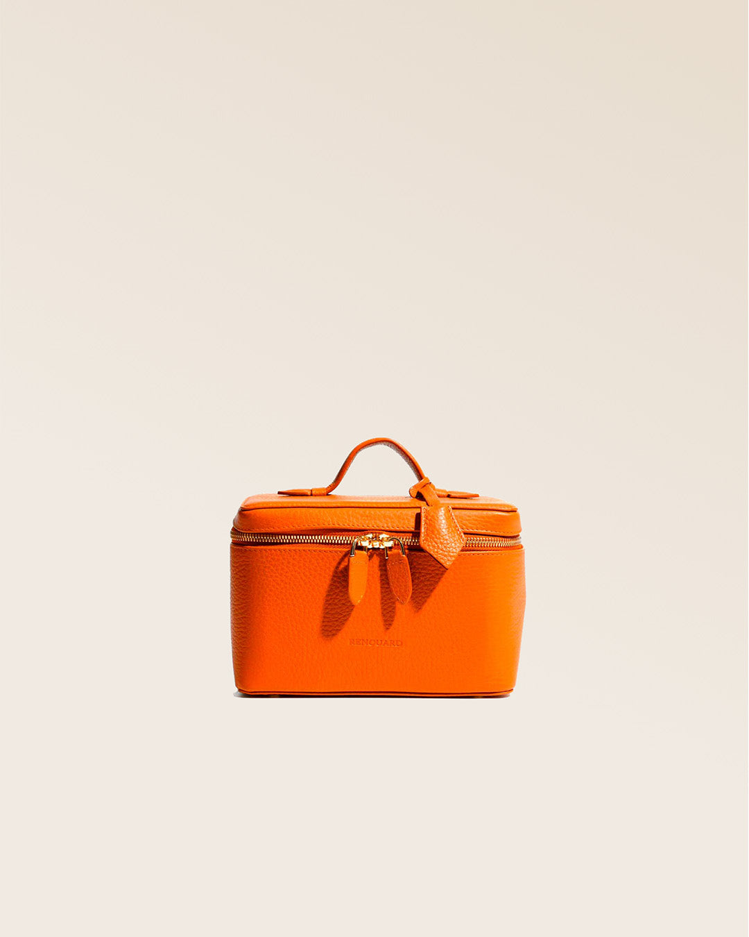 Our little orange vicuña-style leather vanity seen from the front, closed in the studio.