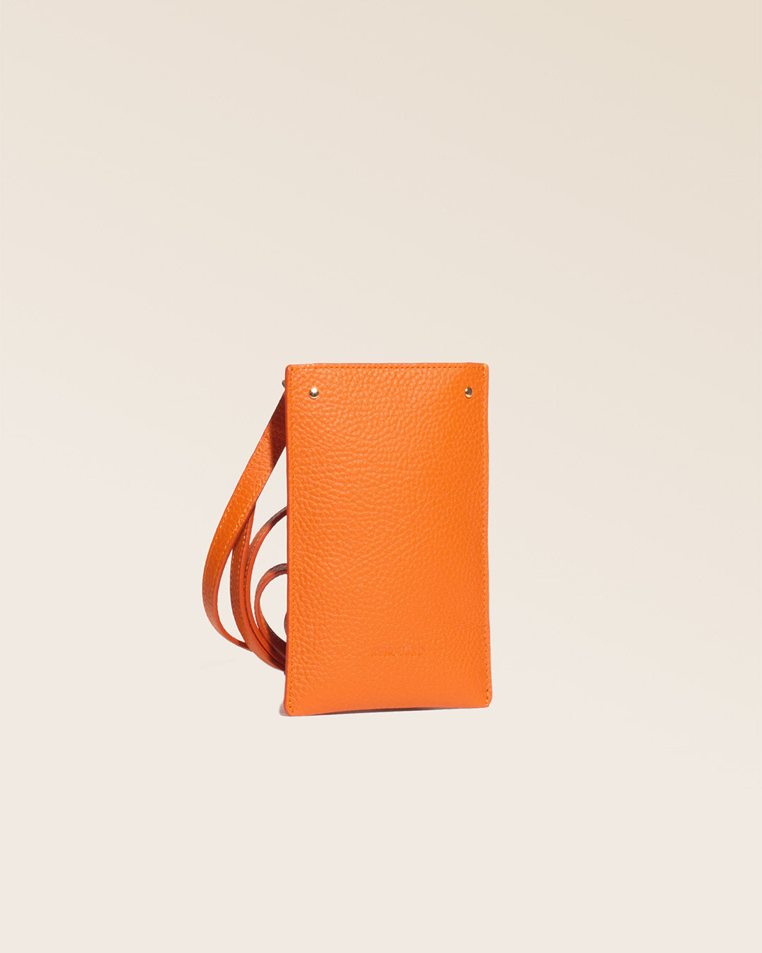 Our Renouard phone pouch in orange vicuña-style leather, seen from the quarter in the studio.