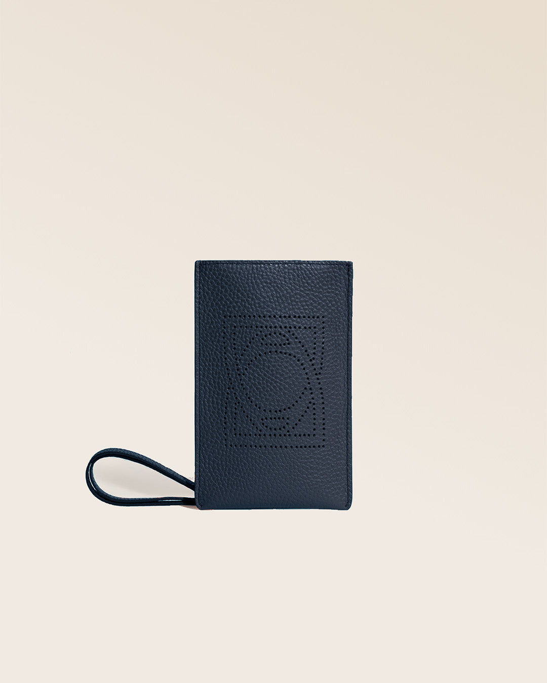 Our Etrivière phone pouch in navy blue vicuña-style leather, seen from the front in the studio.