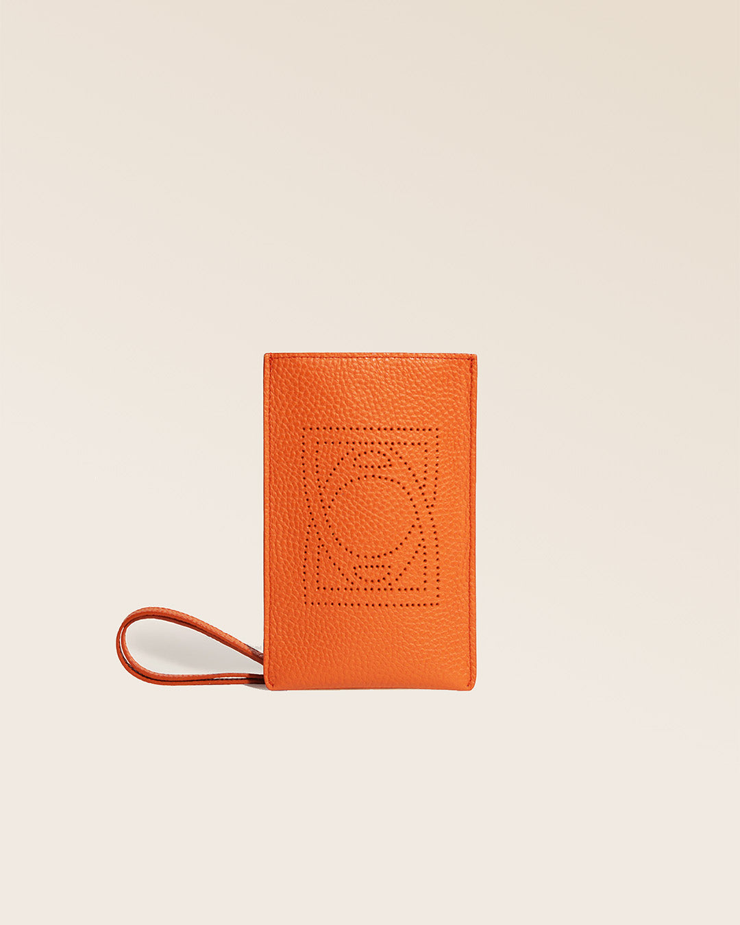 Our Étrivière phone pouch in orange vicuña-style leather, seen from the front in the studio.