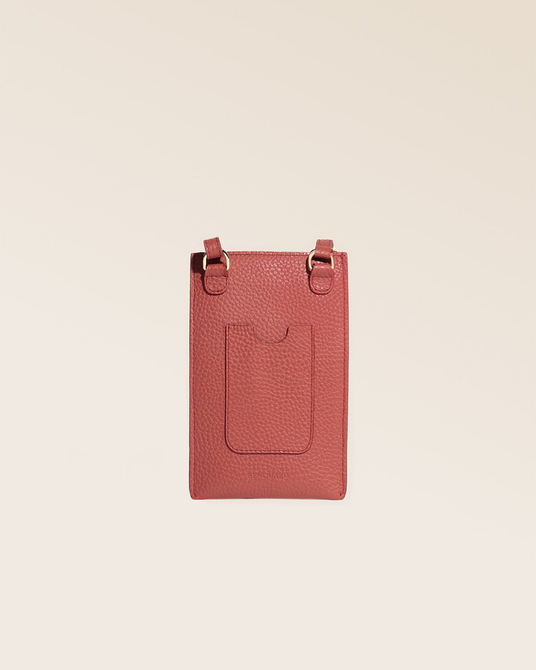 Our Etrivière phone pouch in terracotta vicuña-style leather, seen from the back in the studio.