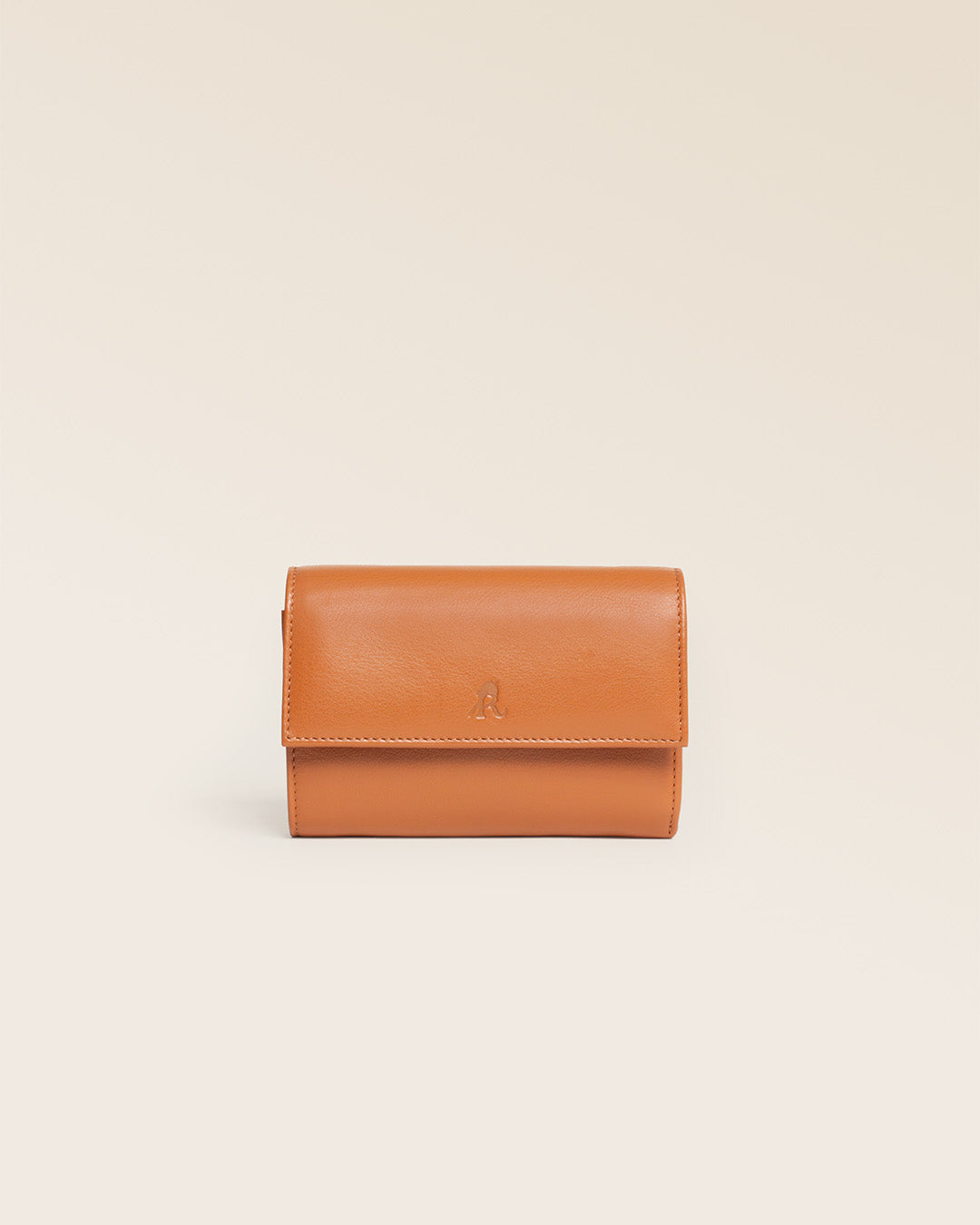 Our Opale Renouard wallet in vintage camel leather, seen from the front in the studio.