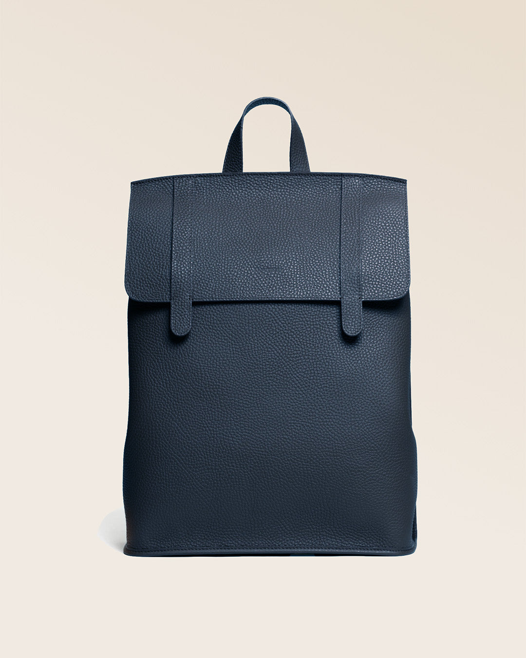 Our Alex backpack in navy blue vicuña-style leather, seen from the front.