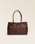 Notre sac Balneum en cuir façon vigogne chocolat vu de face.