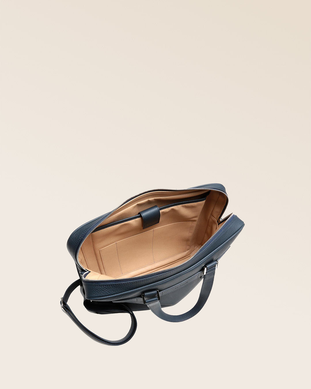 Our Boston satchel bag in navy blue vicuña-style leather, seen from above in the studio.