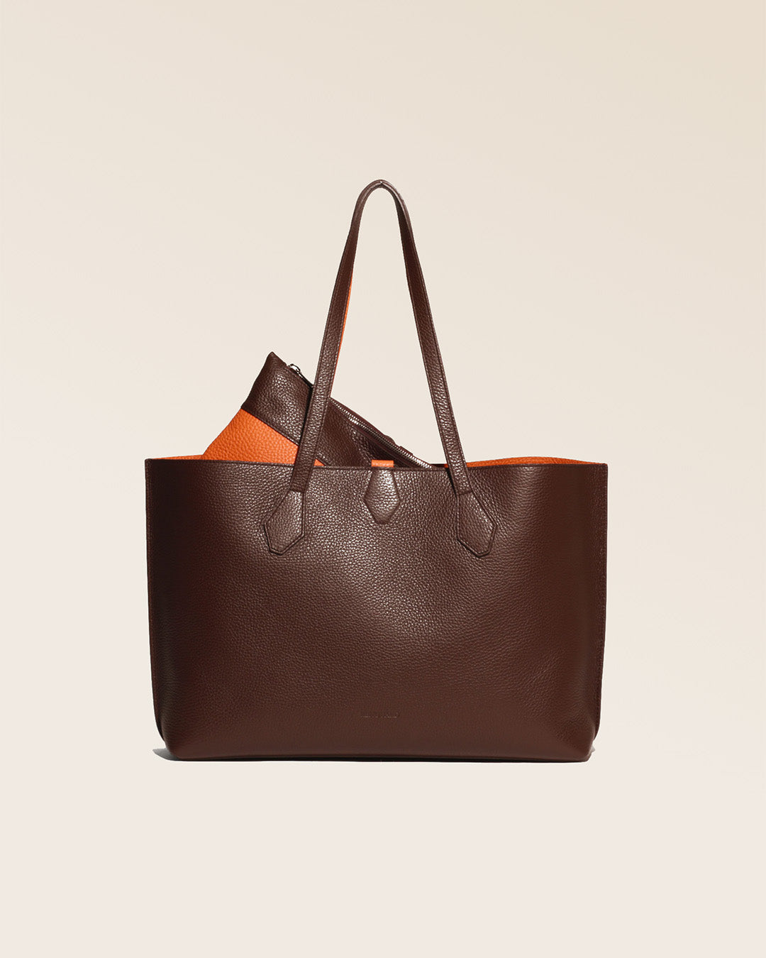 Our Shopper shopping bag in chocolate and orange vicuña-style leather, seen from the front.