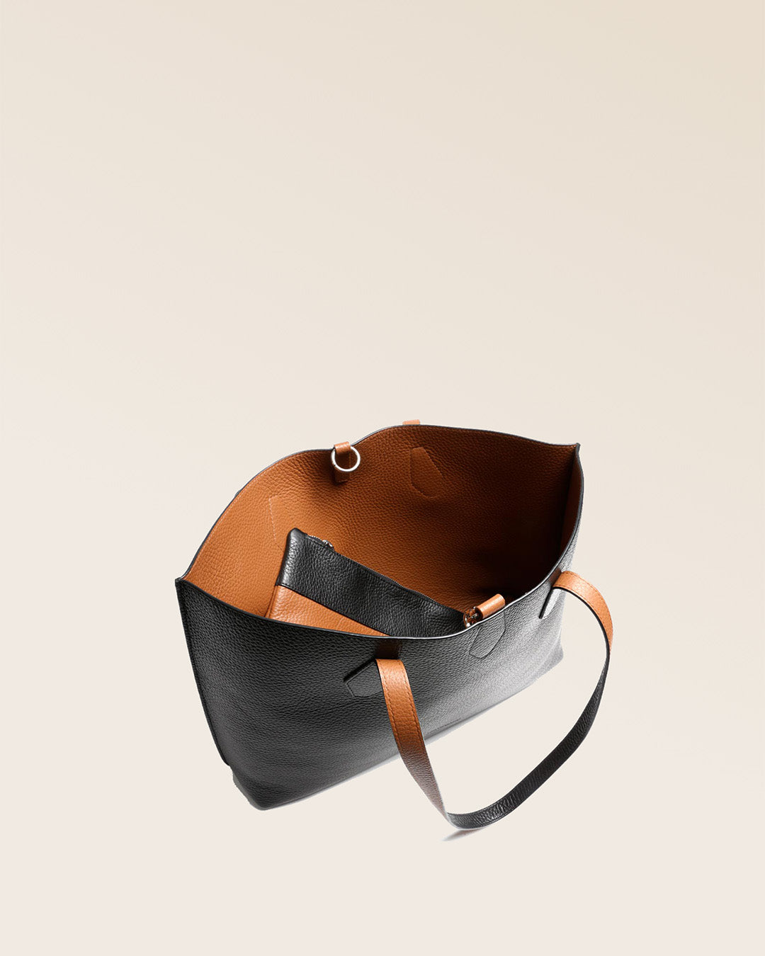 Our Shopper tote bag in black and fawn vicuña-style leather, seen from above.