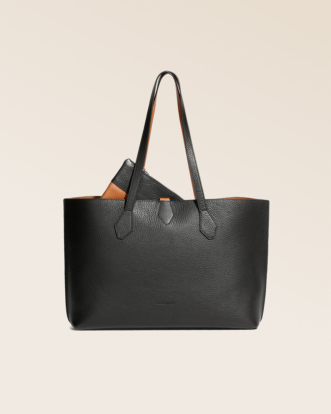 Our Shopper tote bag in black and fawn vicuna-style leather, seen from the front.