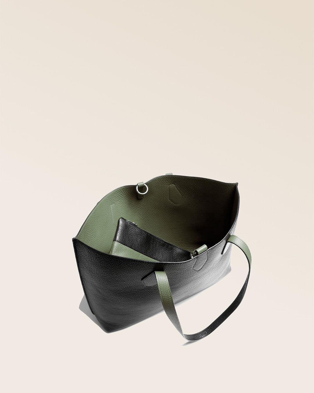 Our Shopper tote bag in black and khaki vicuña-style leather, seen from above.