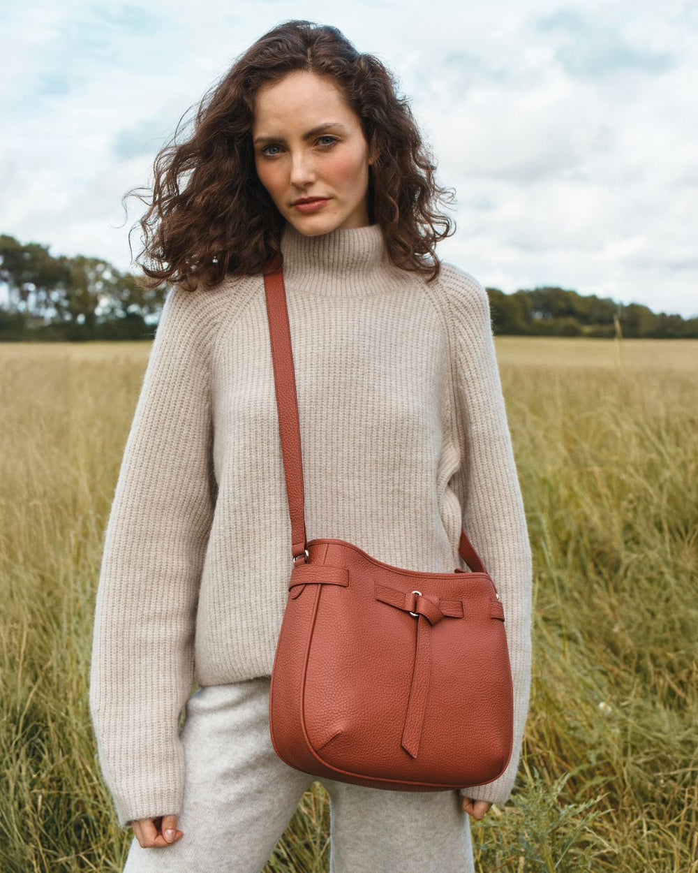 Our Cameron bag in terracotta vicuña-style leather as seen on our model Léa.
