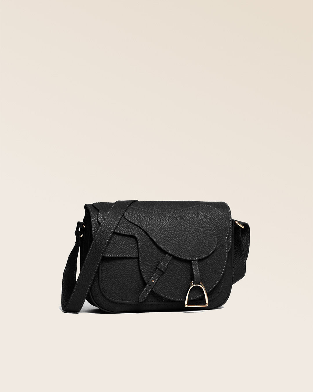 A quarter view of our Casaque bag in black vicuña-style leather.