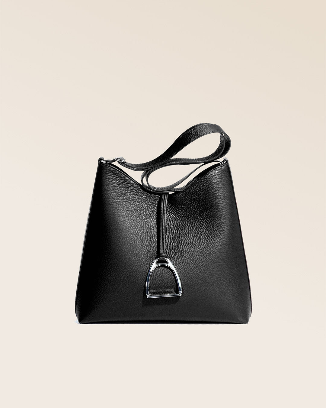 Our large Cob bag in black vicuña-style leather, seen from the front in the studio.
