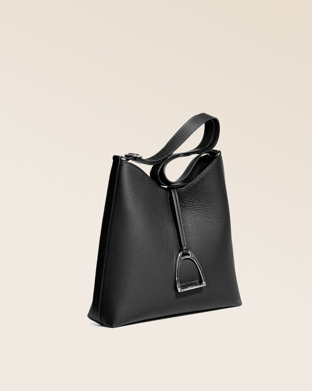 Our large Cob bag in black vicuña-style leather, seen from the quarter in the studio.