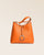 Notre sac Cob grand modèle en cuir façon vigogne orange vu de face en studio.