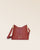 Our Cob Renouard bag in its Mini version, terracotta vicuña-style leather and leather shoulder strap; seen from the front in the studio.