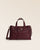 Notre sac Constance Renouard en cuir façon vigogne bordeaux, vu de face en studio.