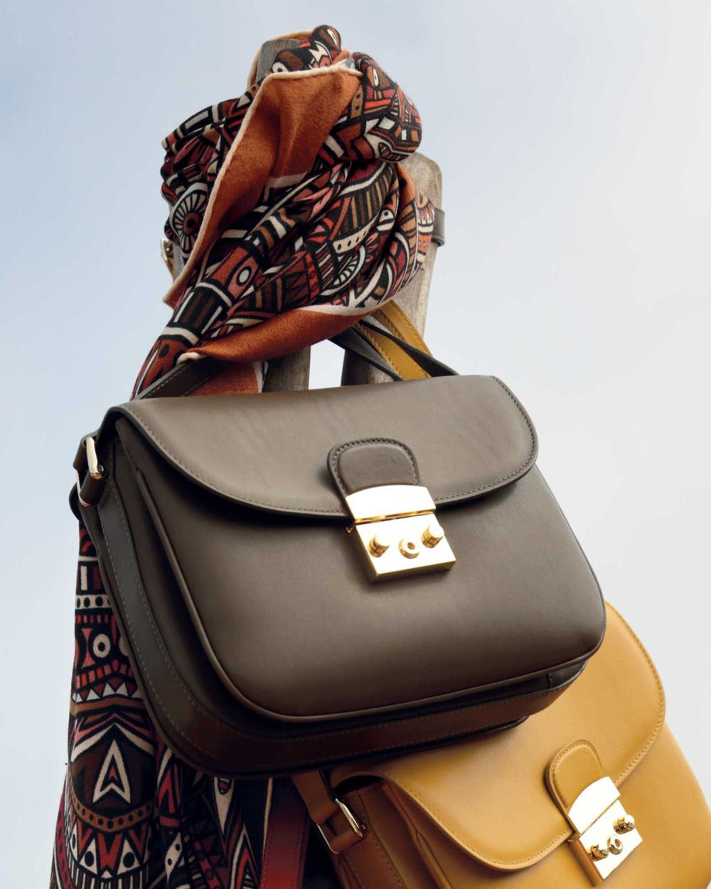 A side view of our Cornouaille bag in smooth truffle leather.