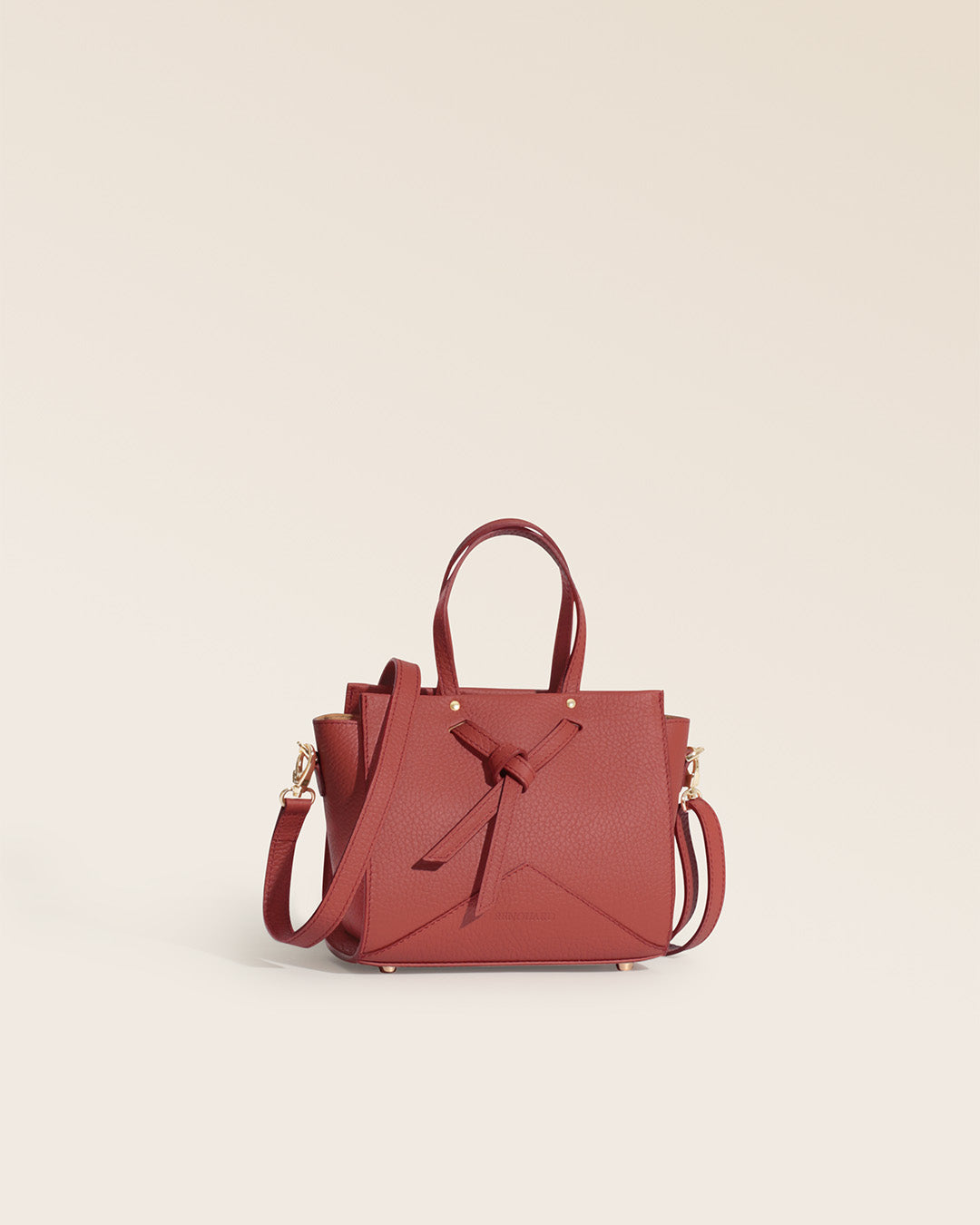 Our Renouard Croisière bag in terracotta vicuña-style leather, seen from the quarter in the studio.