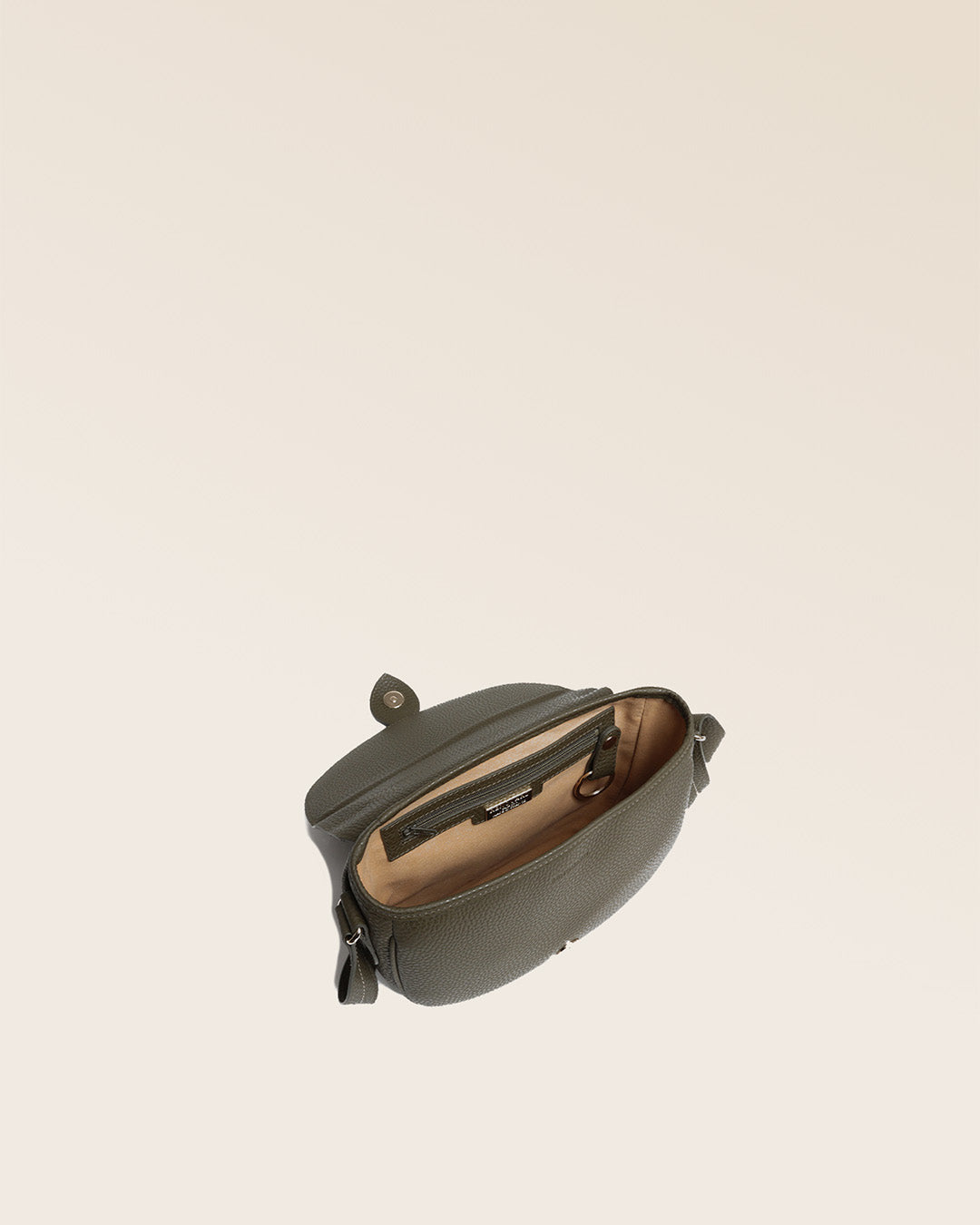 Our Léa khaki vicuña-style leather satchel bag, seen from above in the studio.