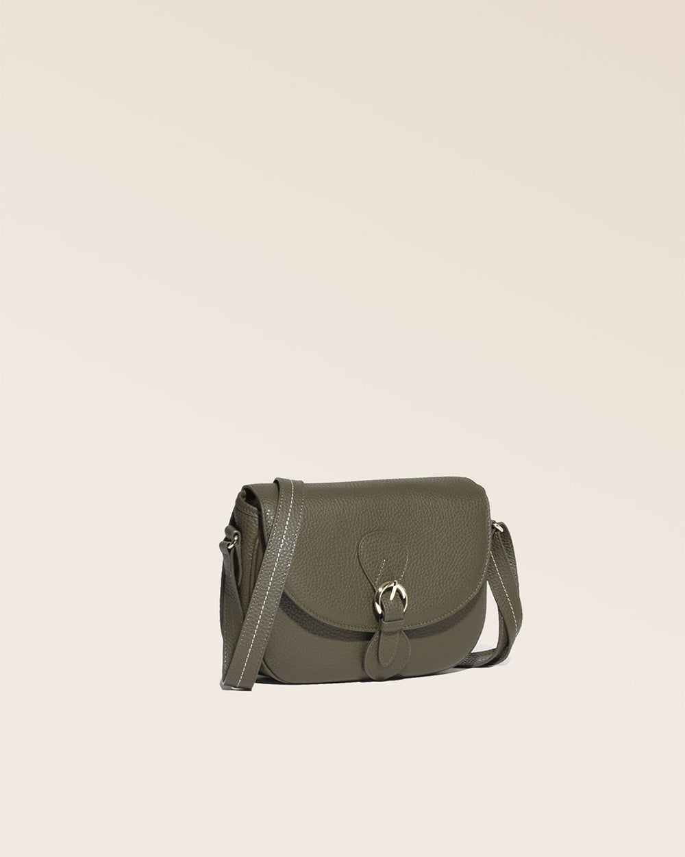Our Léa khaki vicuña-style leather satchel seen from a quarter in the studio.
