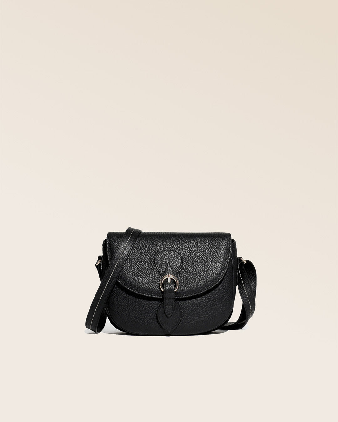 Our Léa black vicuña-style leather satchel, seen from the front in the studio.
