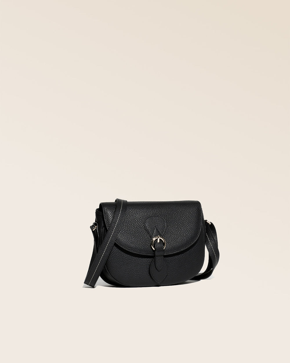 Our Lea black vicuña-style leather satchel seen from a quarter in the studio.