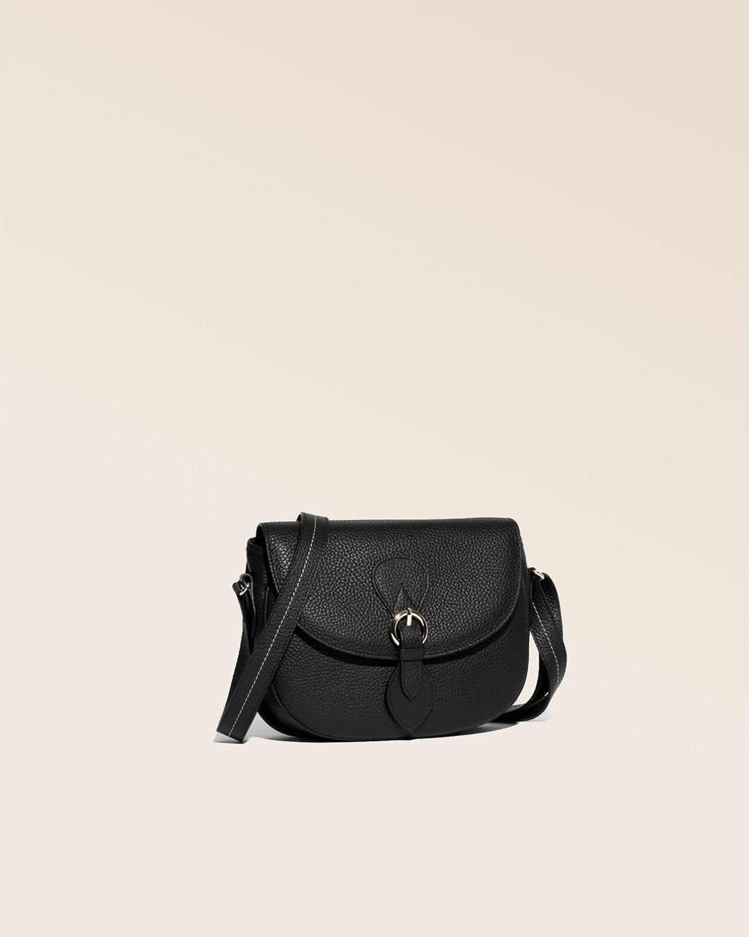 Our Lea black vicuña-style leather satchel seen from a quarter in the studio.