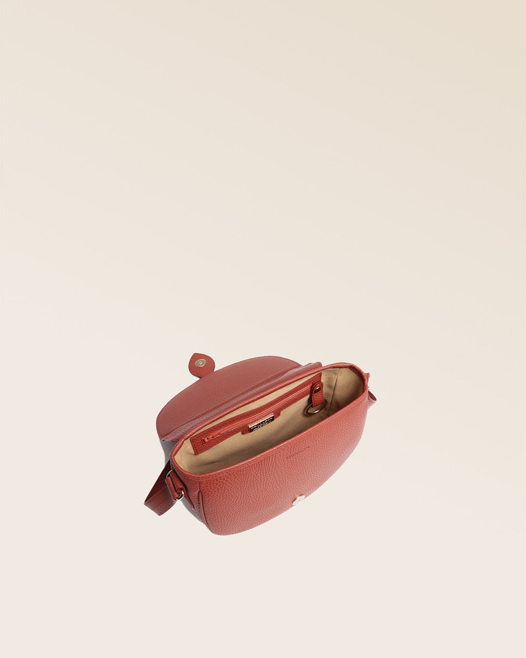 Our Lea terracotta vicuña bag seen from above in the studio.