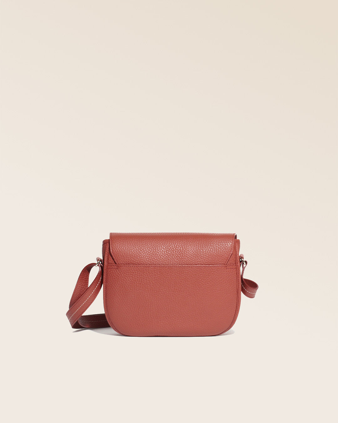Our Lea terracotta vicuña-style leather satchel seen from the back in the studio.