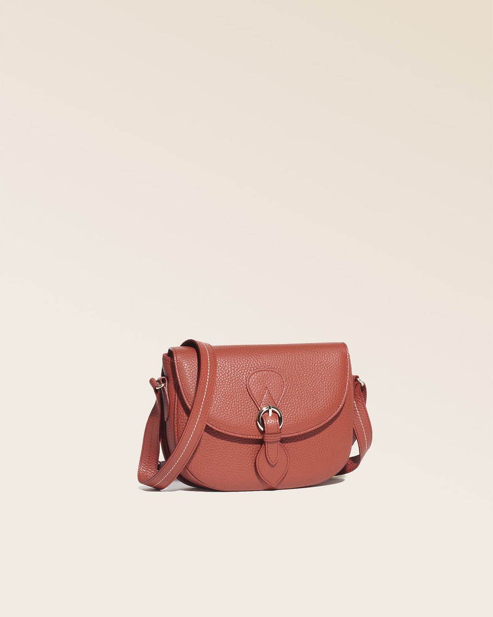 Our Lea terracotta vicuña-style leather satchel bag seen from a quarter in the studio.
