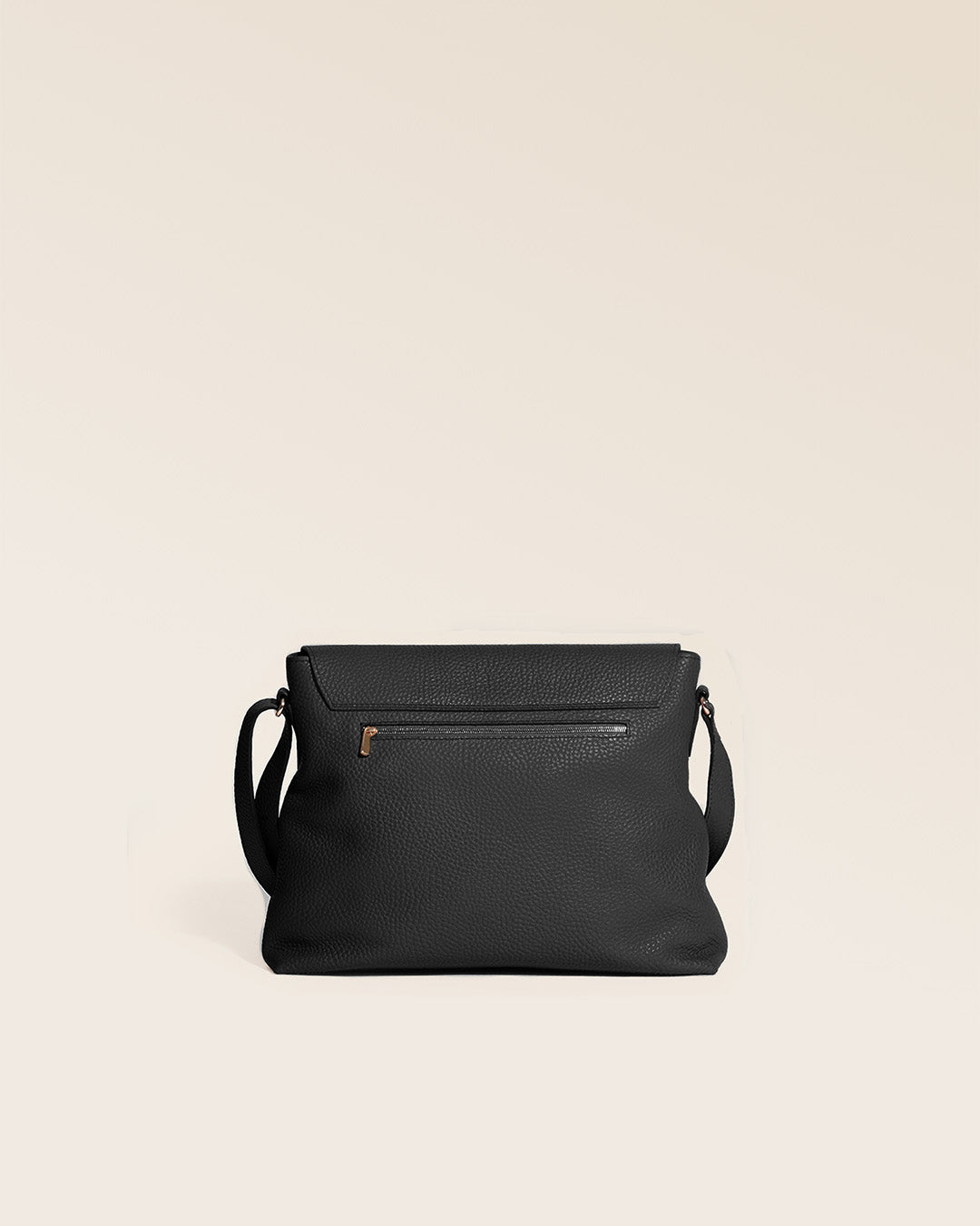 Our Gwenn bag in black vicuña-style leather, seen from the back in the studio.