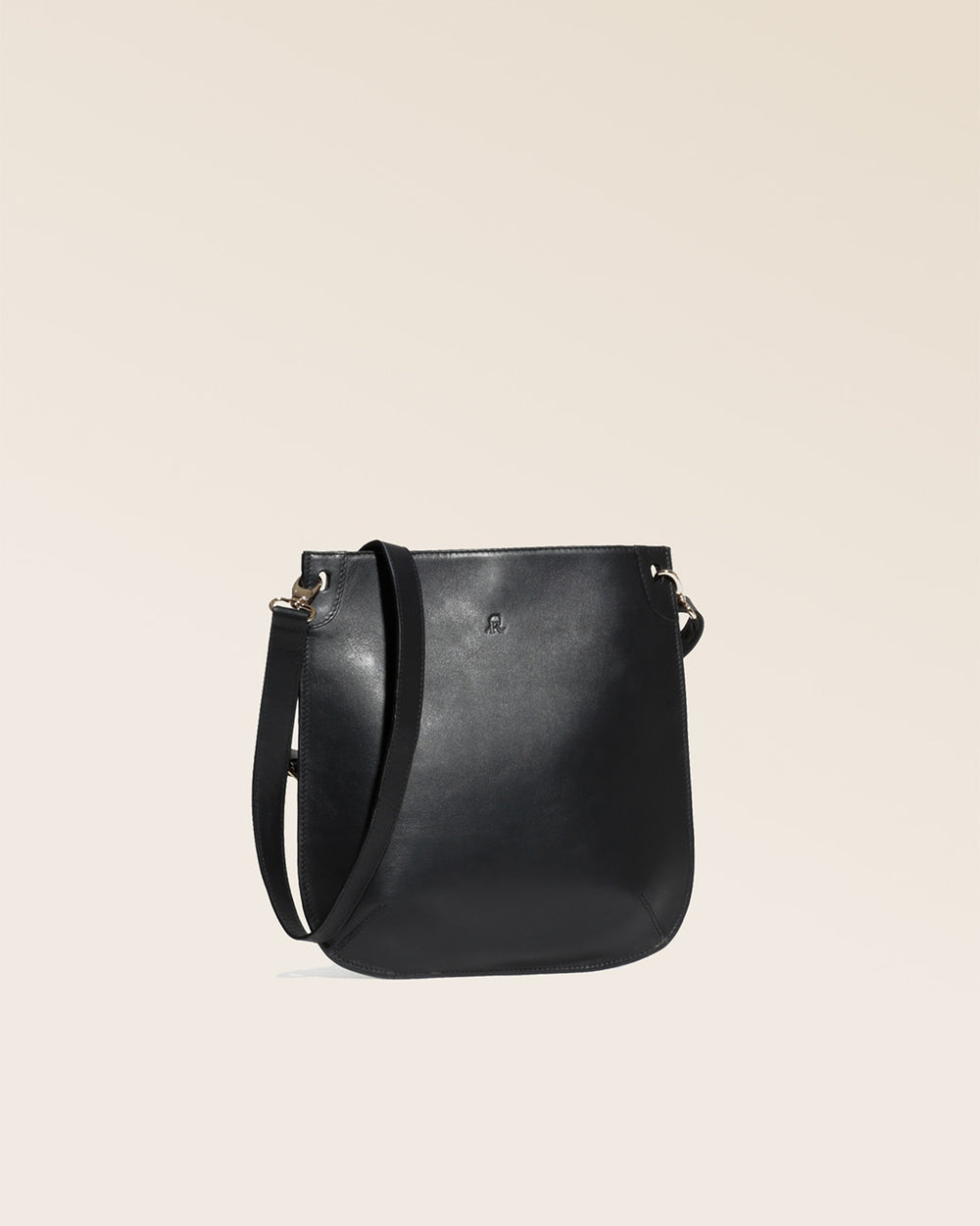 Our Harnais bag in smooth black leather as seen from the quarter in the studio.