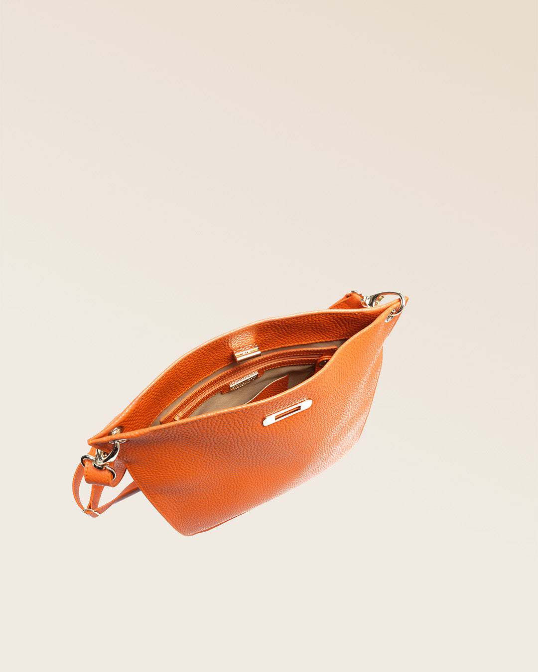 Our Hermine bag in orange vicuña-style leather, seen from above.