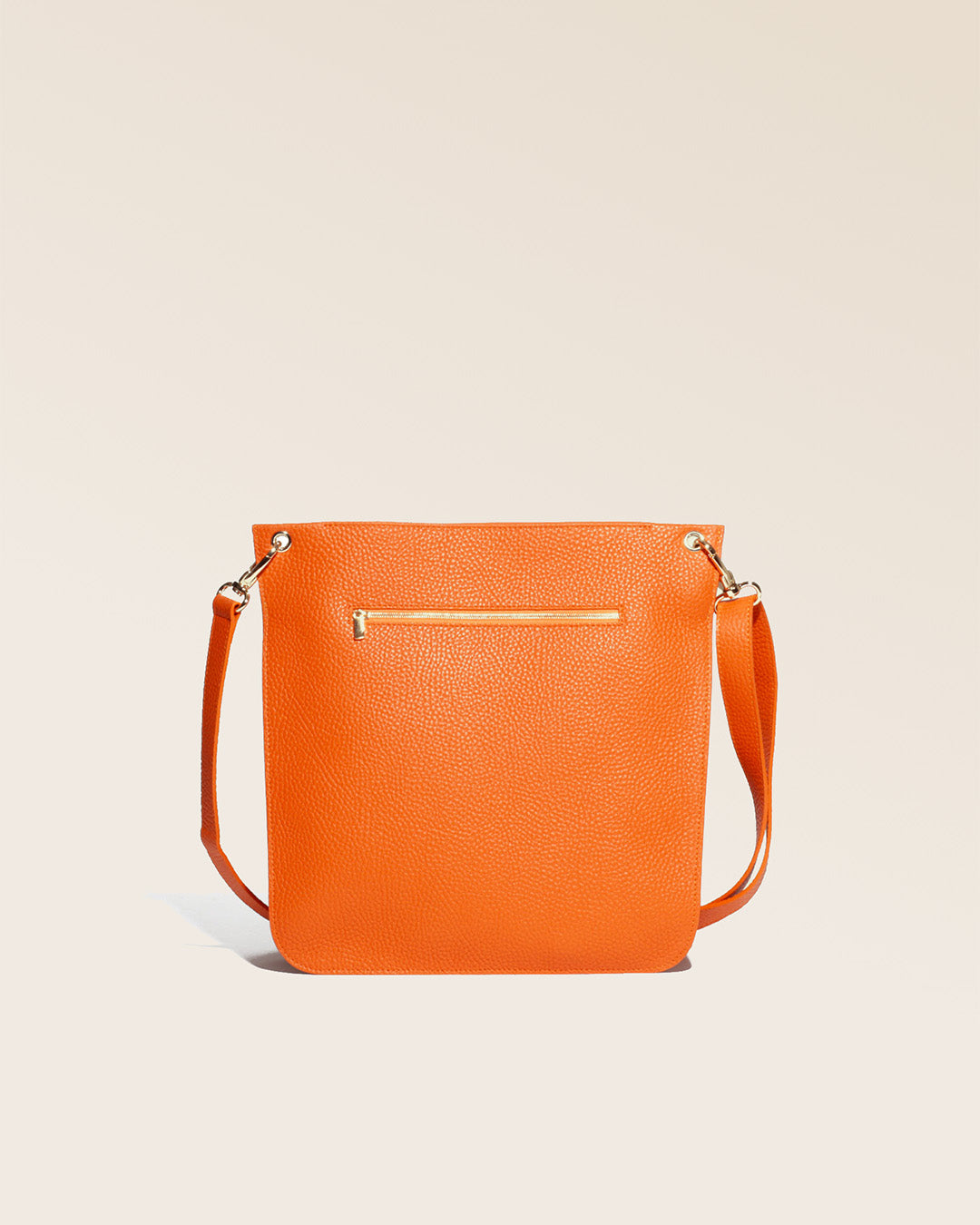 Our Hermine bag in orange vicuña-style leather, seen from the back.