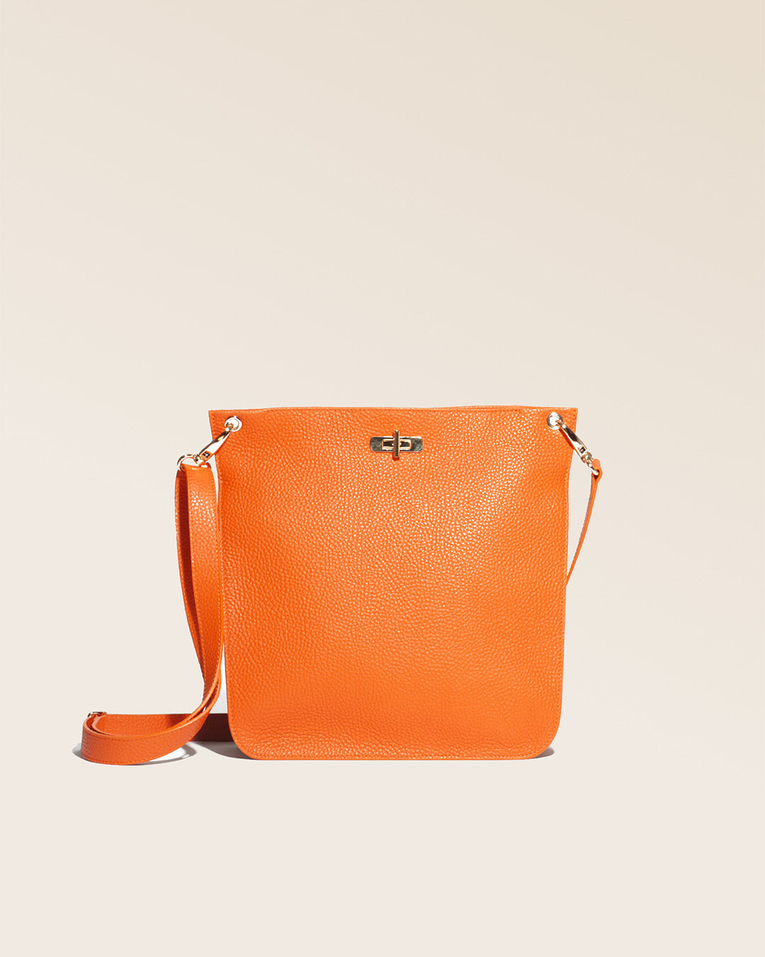 Our Hermine bag in orange vicuña-style leather, seen from the front.