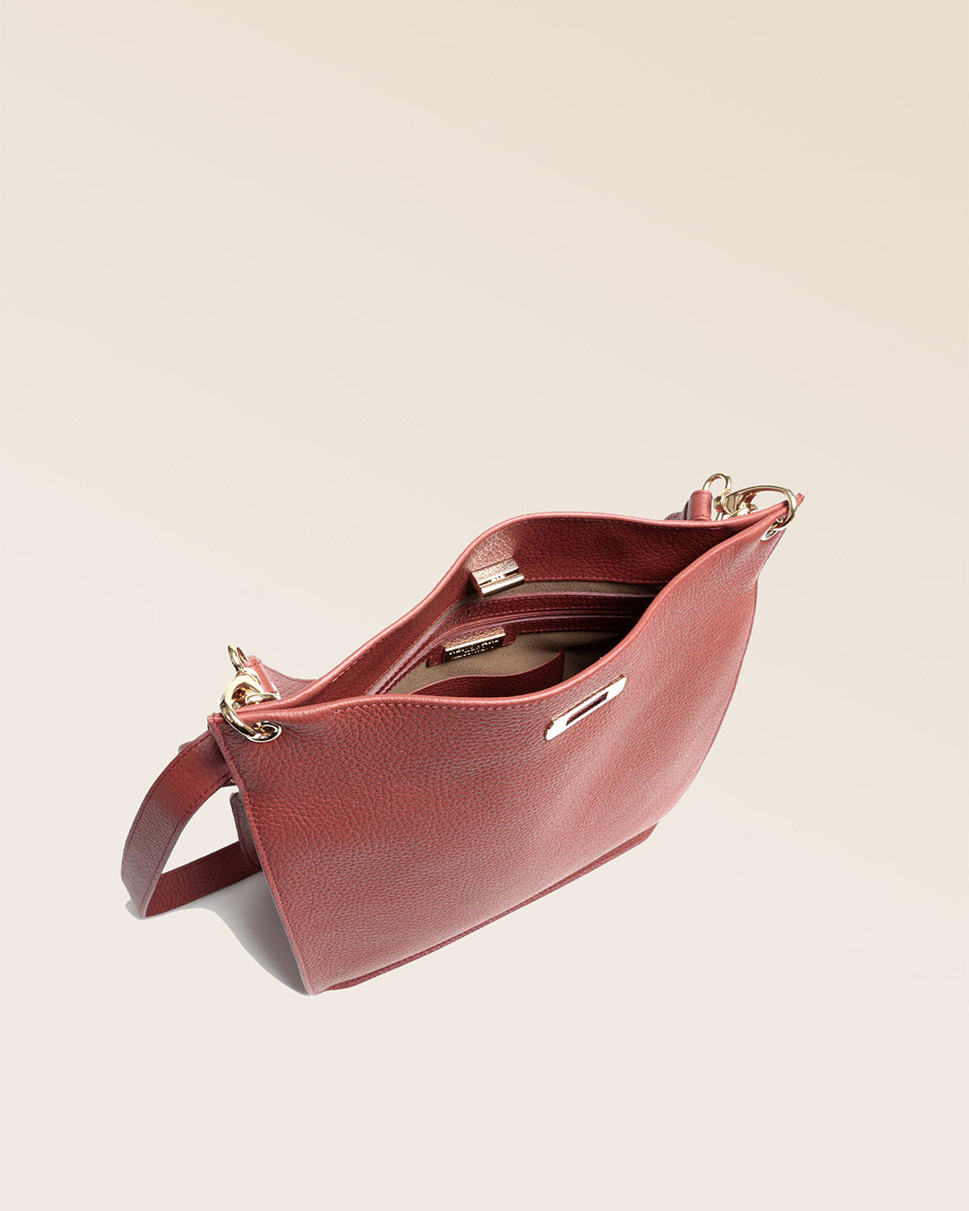 Our Hermine bag in terracotta vicuña-style leather, seen from above.