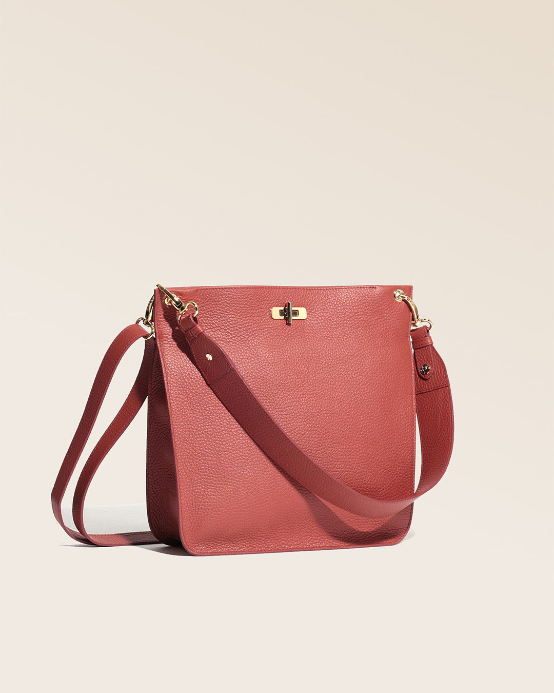 A quarter view of our Hermine bag in terracotta vicuña-style leather.
