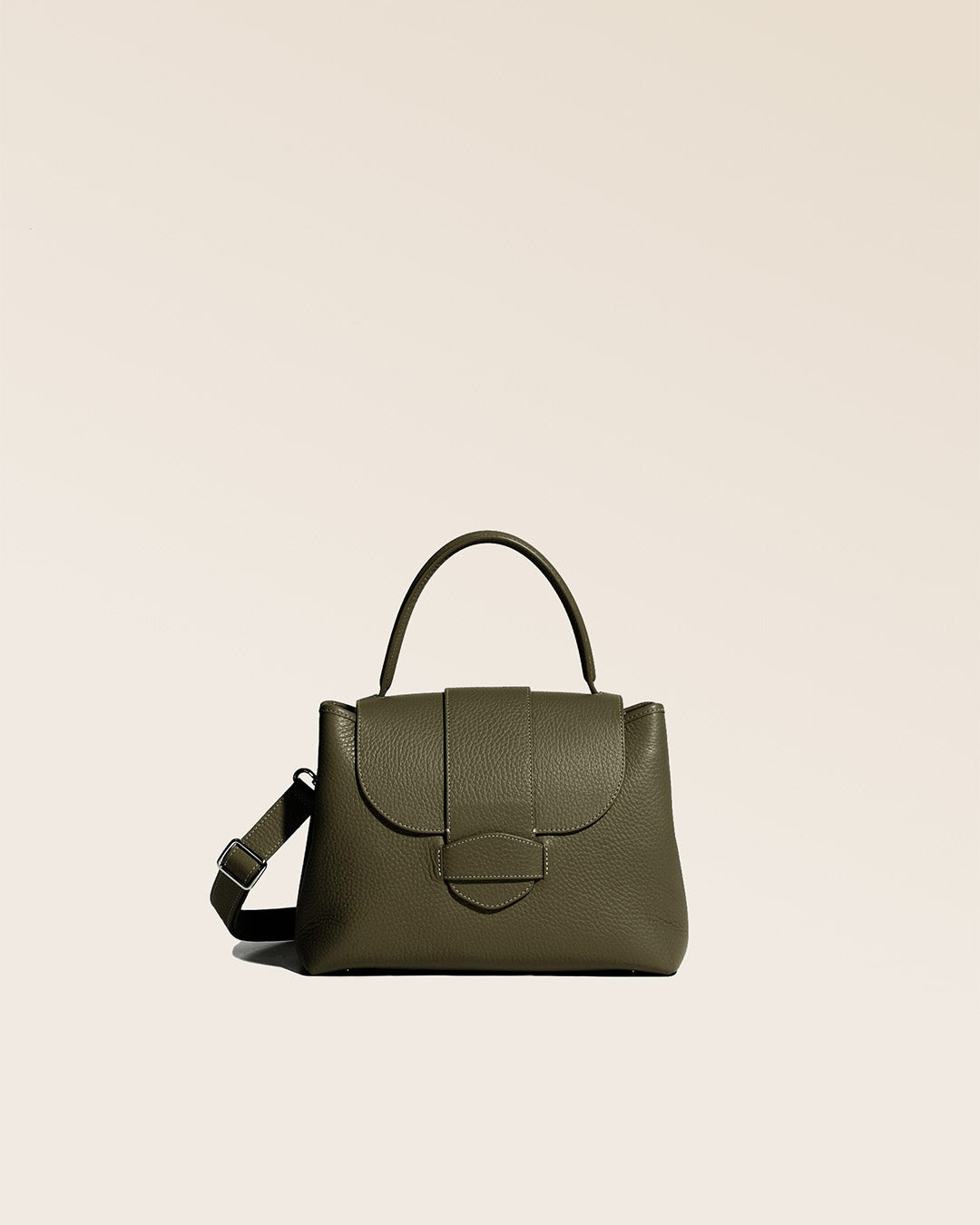 Our khaki vicuña-style leather Kimono bag seen from the front.