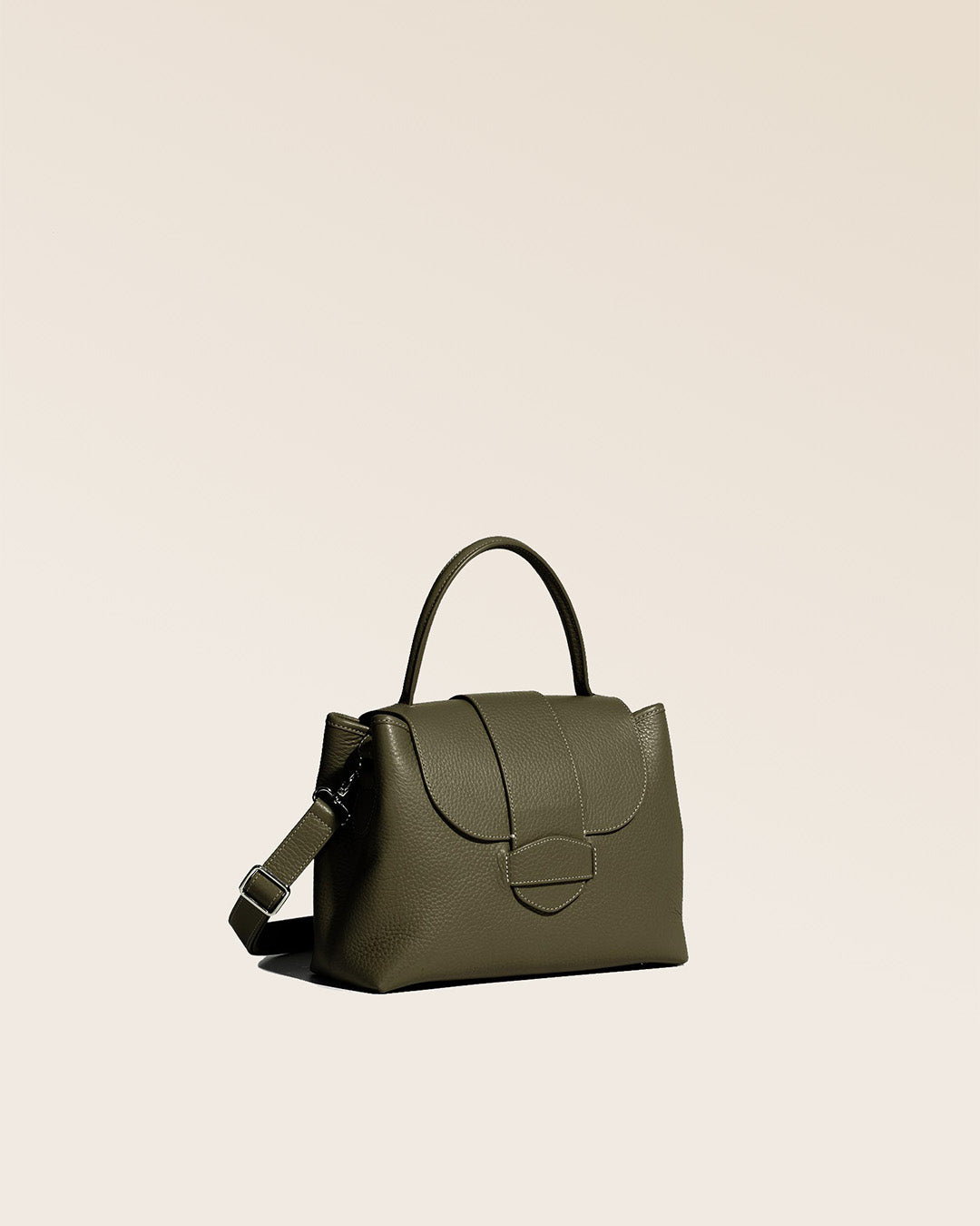 Our khaki vicuña-style leather Kimono bag seen from the quarter.