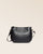 Our Léonore bag in smooth black cowhide seen from the front in the studio.