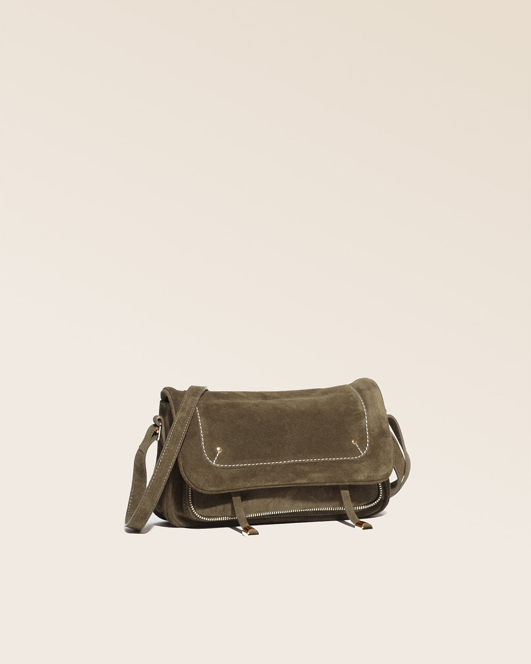 Our Lou bag in truffle suede as seen from the quarter in the studio.