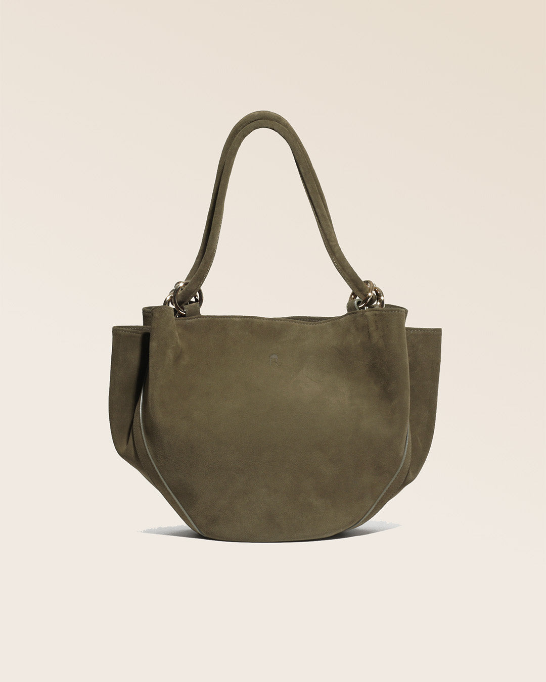 Our Paita bag in truffle suede as seen from the front in the studio.
